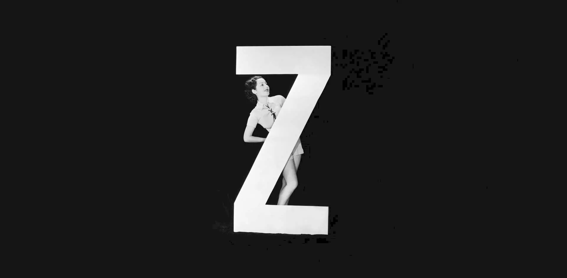 Image of a woman standing with the letter Z
