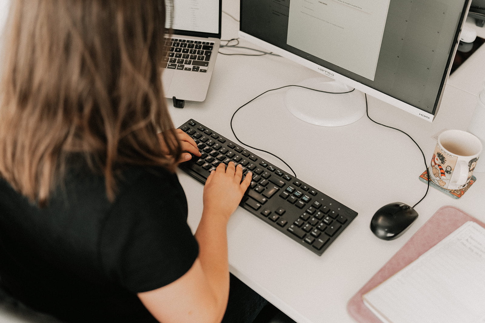 Person working on website improvements - We Are Arise