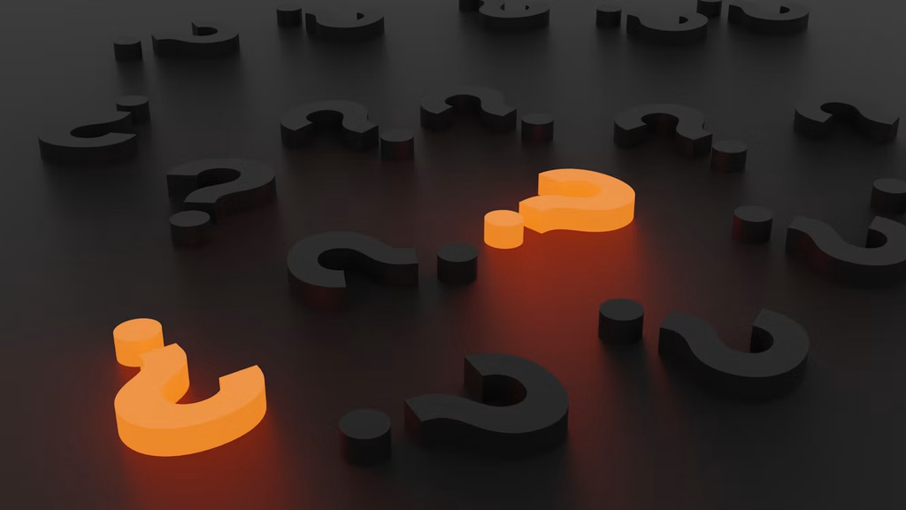 A graphic showing several question marks