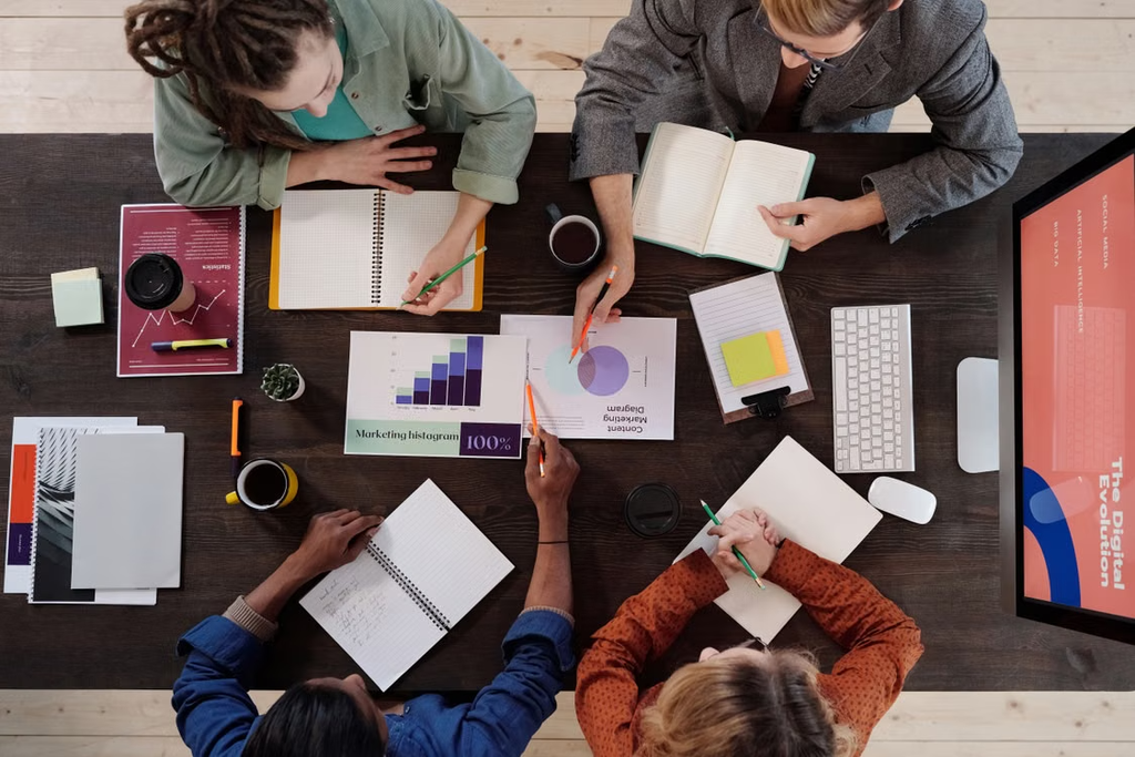 Team of a marketing agency breaking down SEO vs PPC